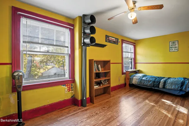 a view of a room with wooden floor