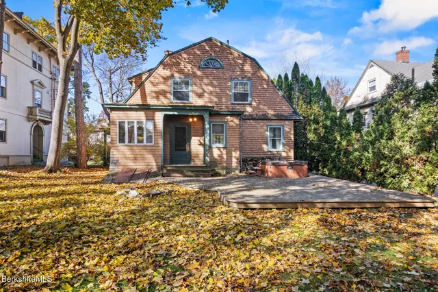 a view of a house with a snow in the yard