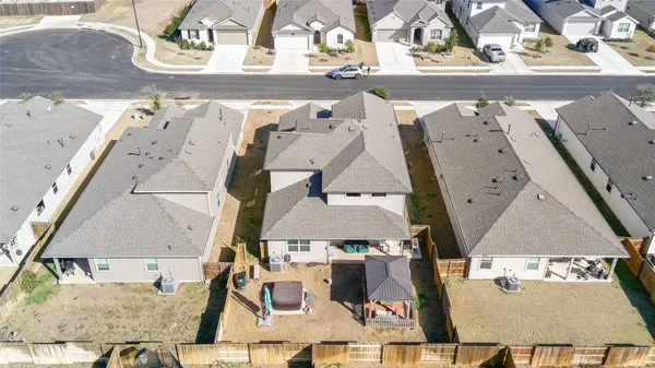 an aerial view of a house with a swimming pool