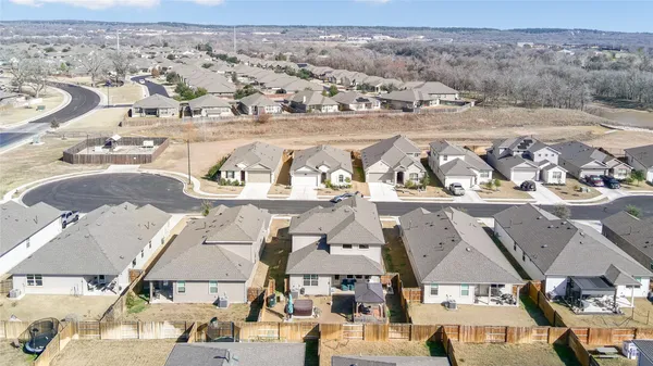an aerial view of residential houses with outdoor space