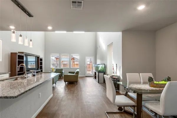 a living room with furniture wooden floor and a fireplace