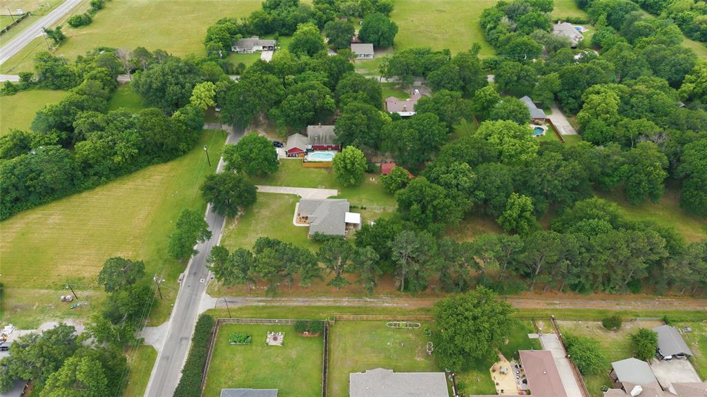 2917 Harlow Road Commerce, TX 75428 - Photo 35 of 40 an aerial view of a residential houses with outdoor space and trees all around