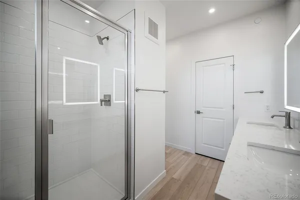 a bathroom with a bathtub and a shower