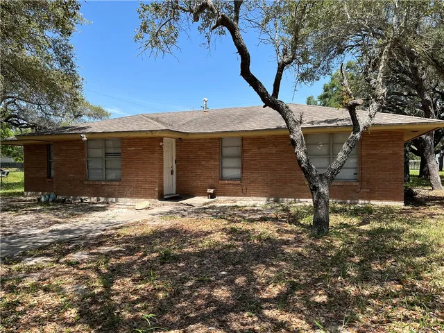 a house with trees in front of it