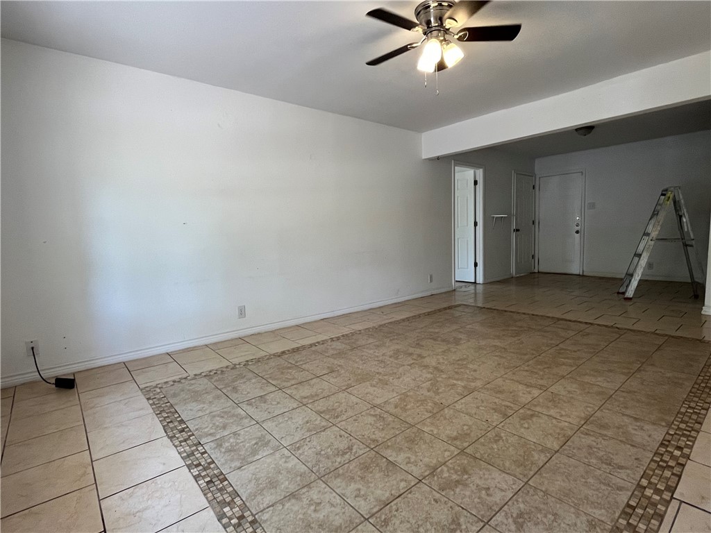 434 South 11th Street Aransas Pass, TX 78336 - Photo 2 of 16 a view of a livingroom with a ceiling fan and window