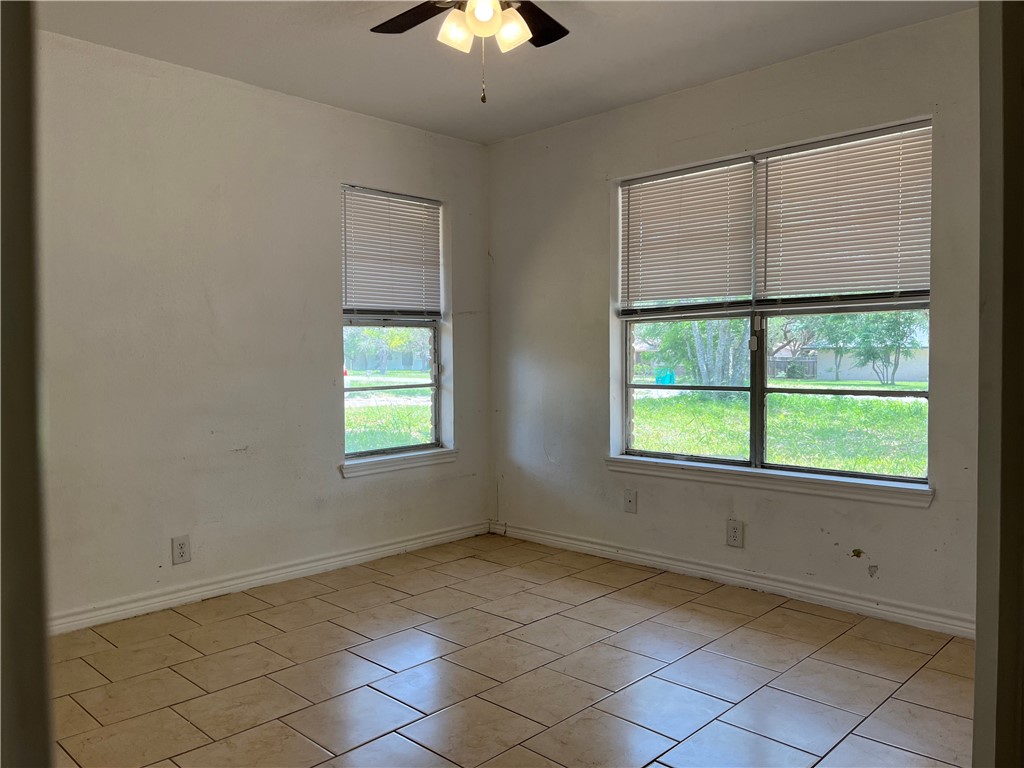 434 South 11th Street Aransas Pass, TX 78336 - Photo 7 of 16 a view of an empty room with a window