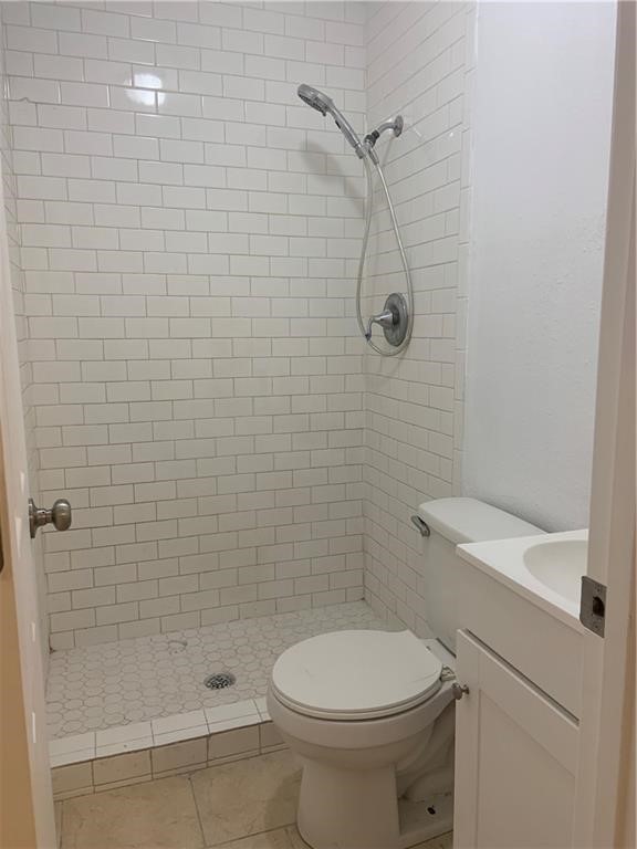 434 South 11th Street Aransas Pass, TX 78336 - Photo 8 of 16 a bathroom with a toilet and shower