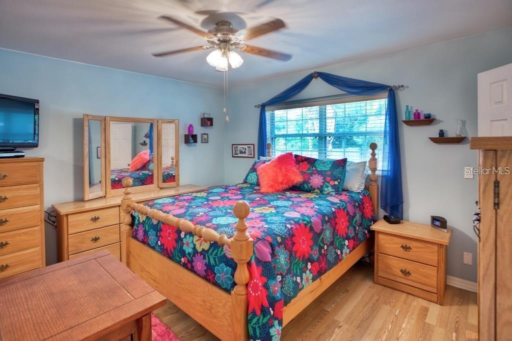 12802 North 53rd Street Temple Terrace, FL 33617 - Photo 17 of 38 a bedroom with a bed dresser and window