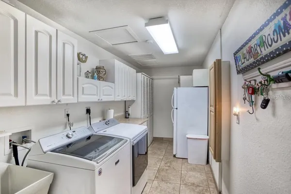 a kitchen with a sink stove and refrigerator