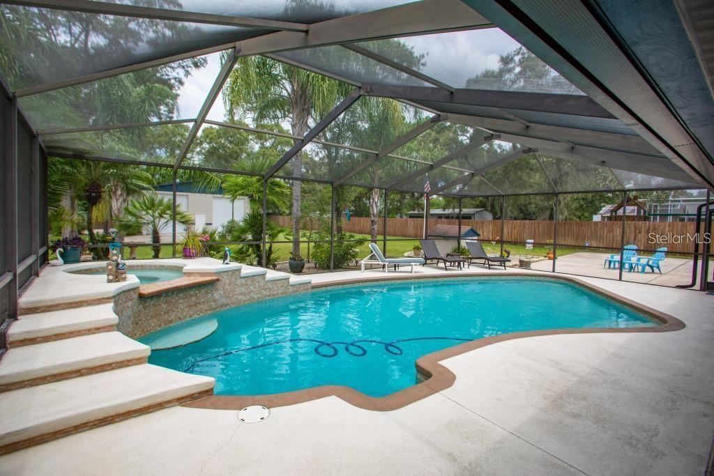 12802 North 53rd Street Temple Terrace, FL 33617 - Photo 24 of 38 a view of swimming pool with a patio