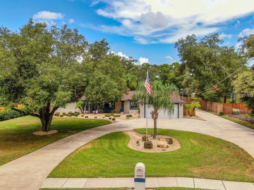 12802 North 53rd Street Temple Terrace, FL 33617 - Photo 38 of 38 a swimming pool with lots of tress in the background