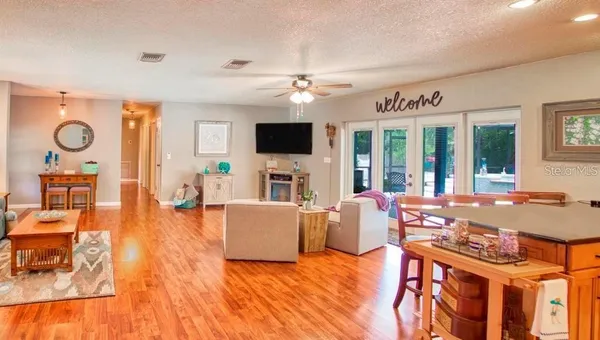 a living room with fireplace furniture and a flat screen tv