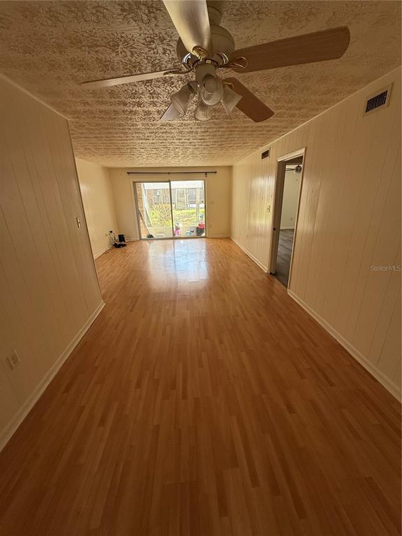 4320 Lake Underhill Road, Unit 14D2 Orlando, FL 32803 - Photo 2 of 15 a view of empty room with wooden floor