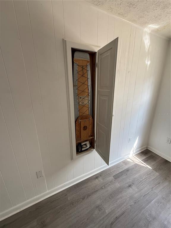 4320 Lake Underhill Road, Unit 14D2 Orlando, FL 32803 - Photo 5 of 15 a view of an empty room with wooden floor