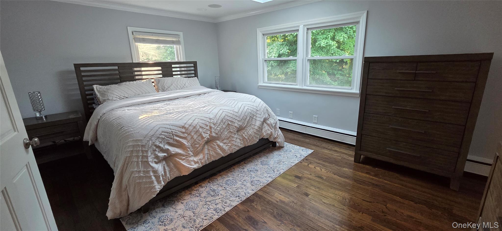 522 Moriches Road St. James, NY 11780 - Photo 33 of 49 a bed sitting in a bedroom next to a window