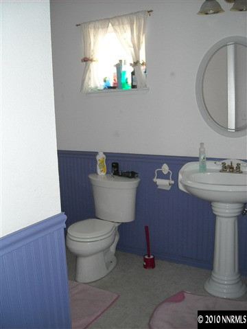 2782 Azuza Way Reno, NV 89502 - Photo 6 of 9 a bathroom with a toilet sink and mirror