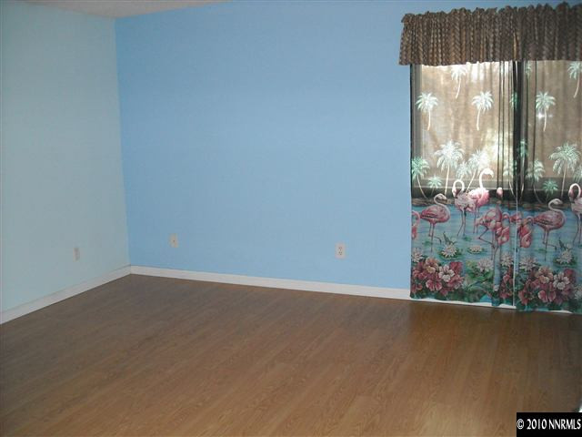 2782 Azuza Way Reno, NV 89502 - Photo 8 of 9 an empty room with a floor to ceiling window