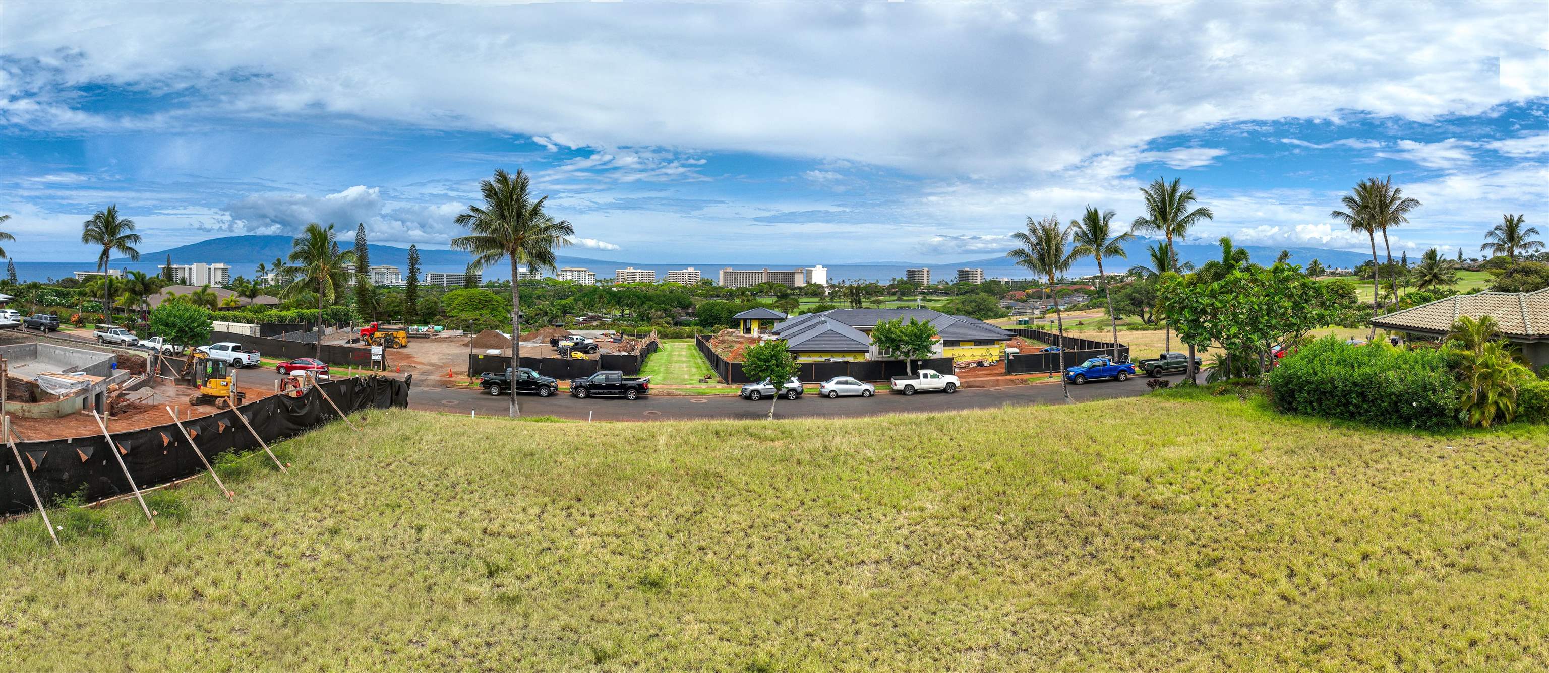 167 Anapuni Loop, Unit 26 Lahaina, HI 96761 - Photo 19 of 27 a view of a swimming pool with lawn chairs and a potted plants