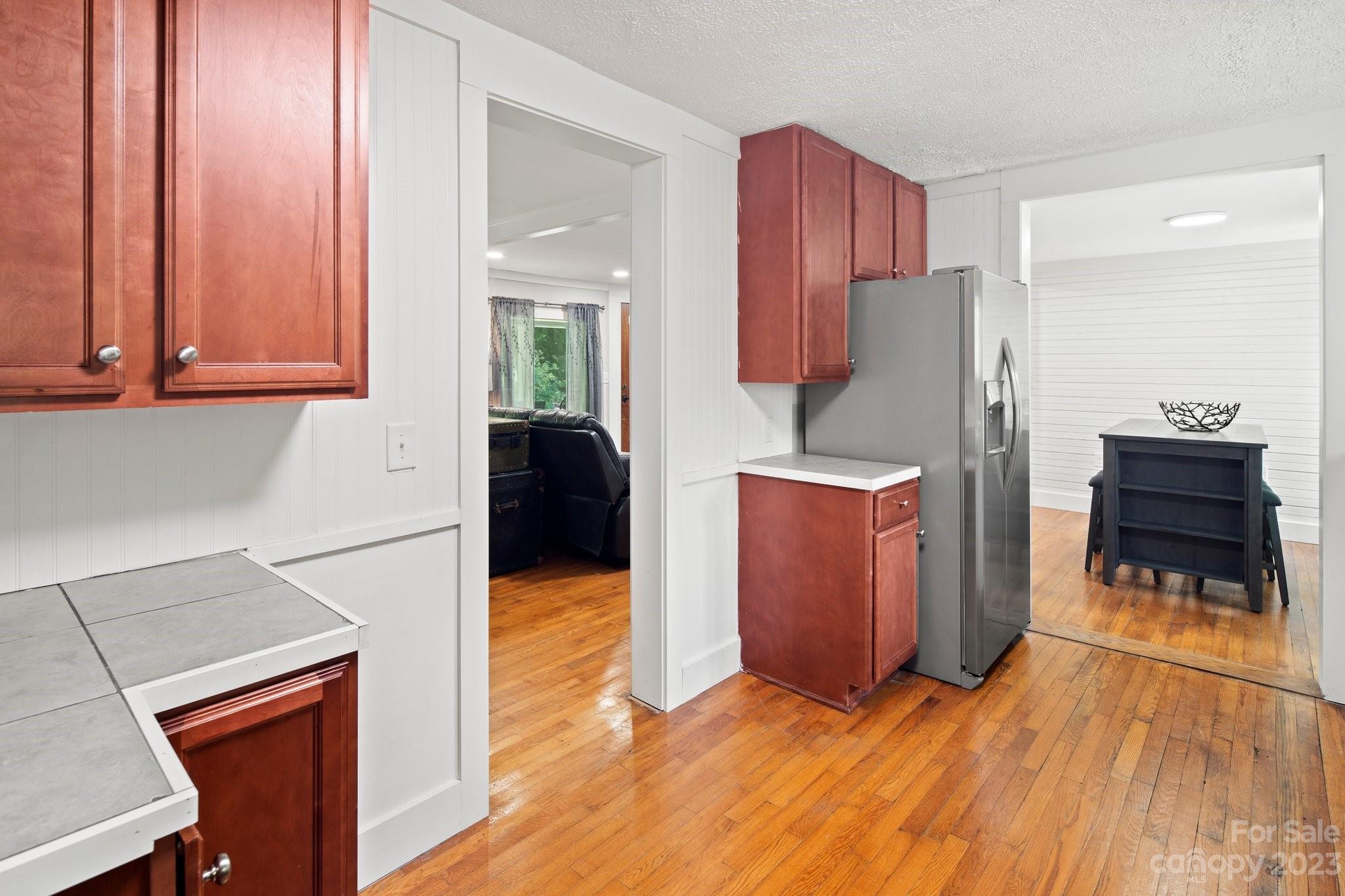 115 James E Davis Drive Mills River, NC 28759 - Photo 14 of 27 a kitchen with stainless steel appliances a refrigerator and a stove top oven