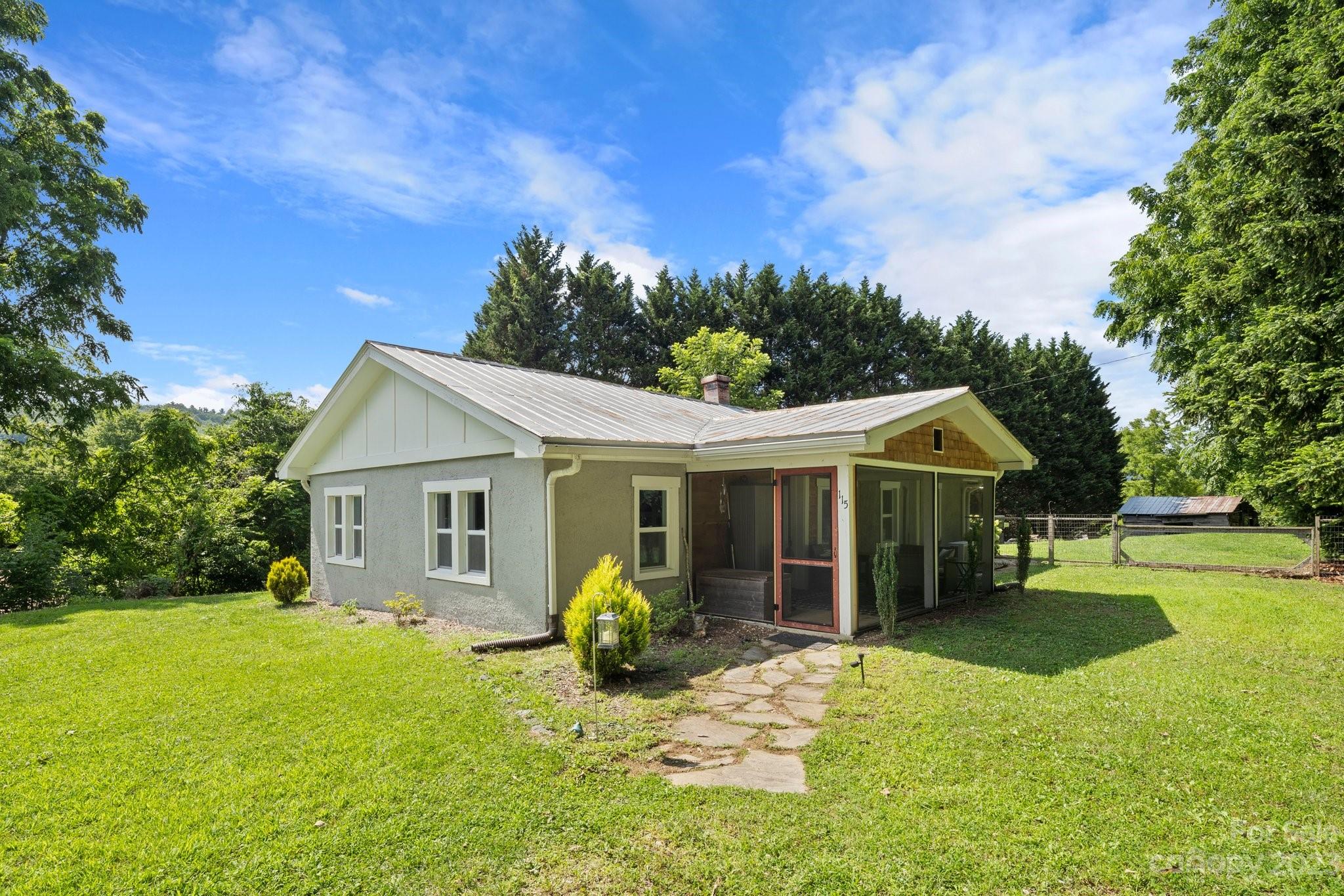 115 James E Davis Drive Mills River, NC 28759 - Photo 2 of 27 a view of a house with a yard