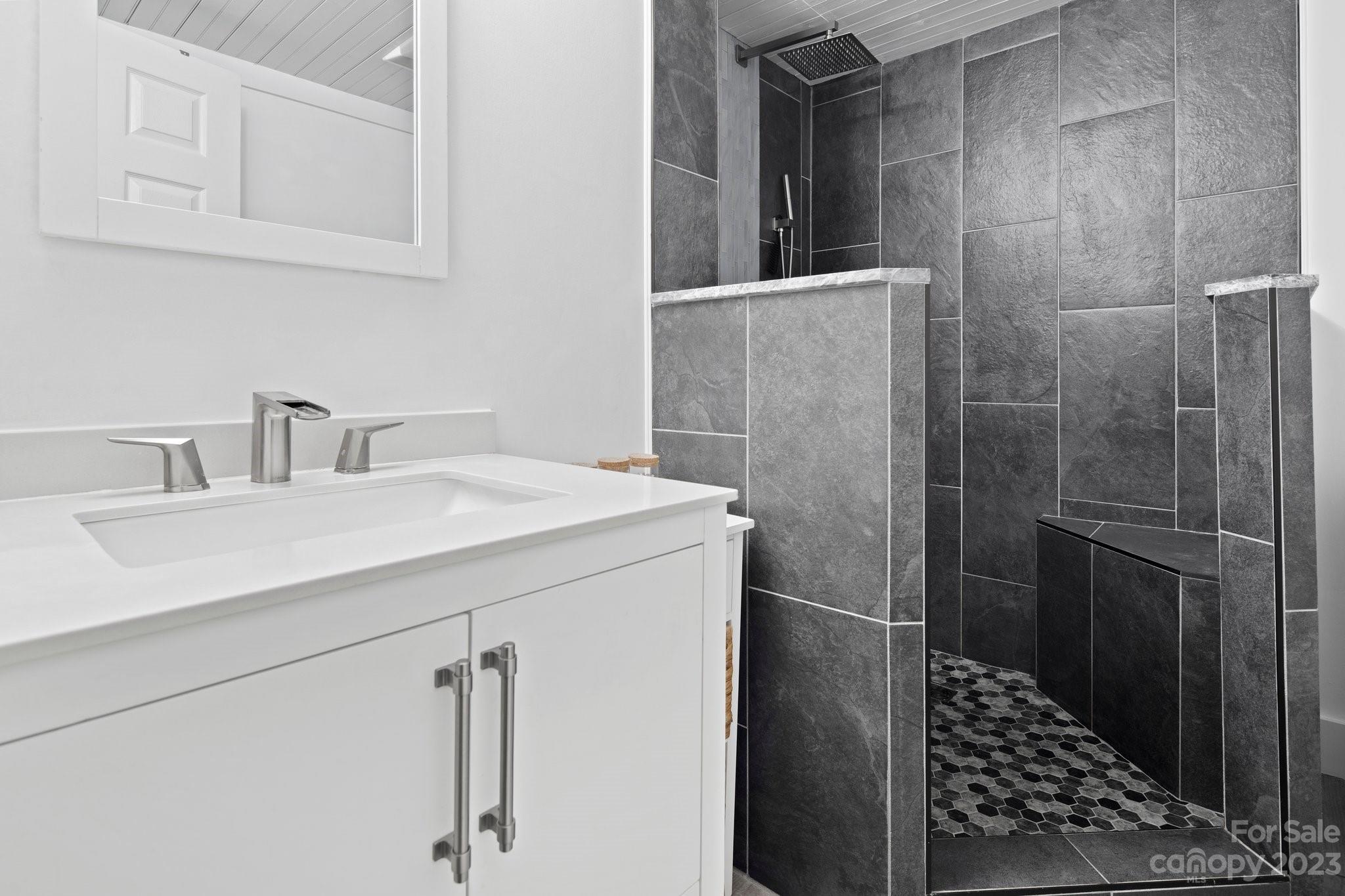 115 James E Davis Drive Mills River, NC 28759 - Photo 22 of 27 a bathroom with a sink and mirror