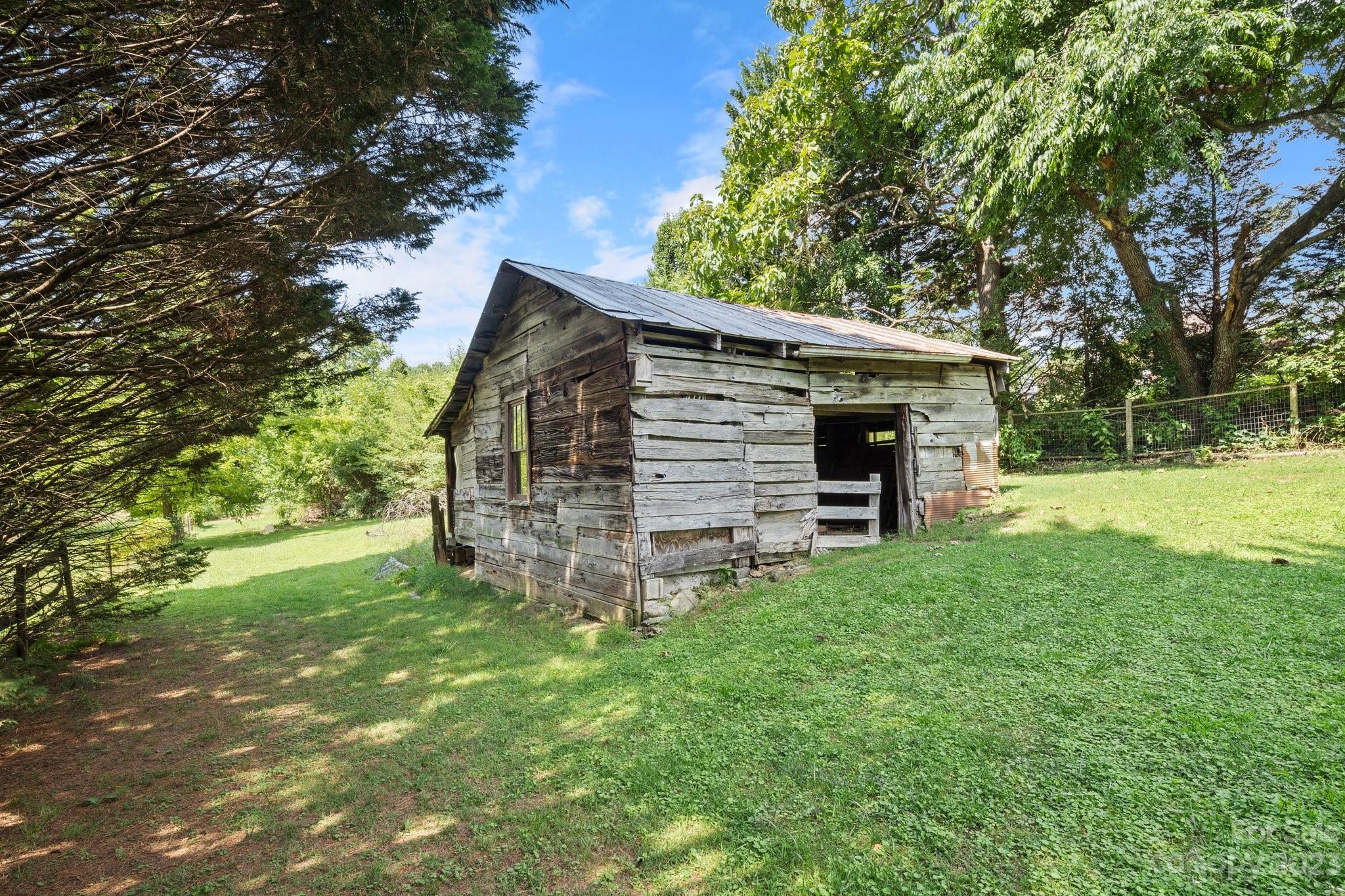 115 James E Davis Drive Mills River, NC 28759 - Photo 26 of 27 a view of a house with a yard