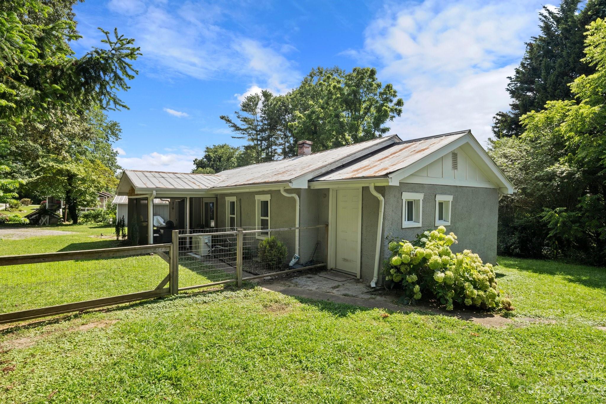115 James E Davis Drive Mills River, NC 28759 - Photo 3 of 27 a view of a house with garden