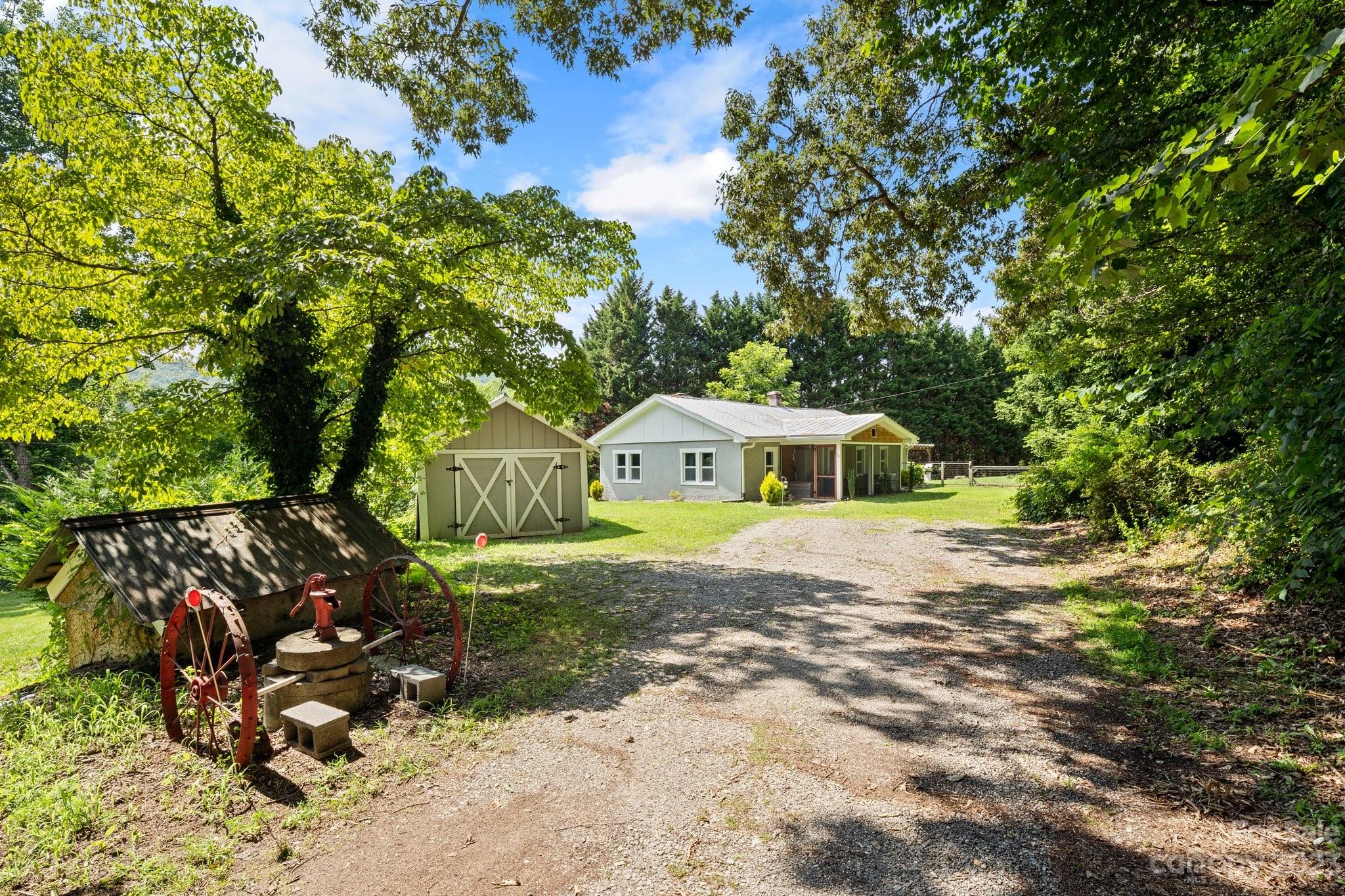 115 James E Davis Drive Mills River, NC 28759 - Photo 4 of 27 a view of a house with a yard