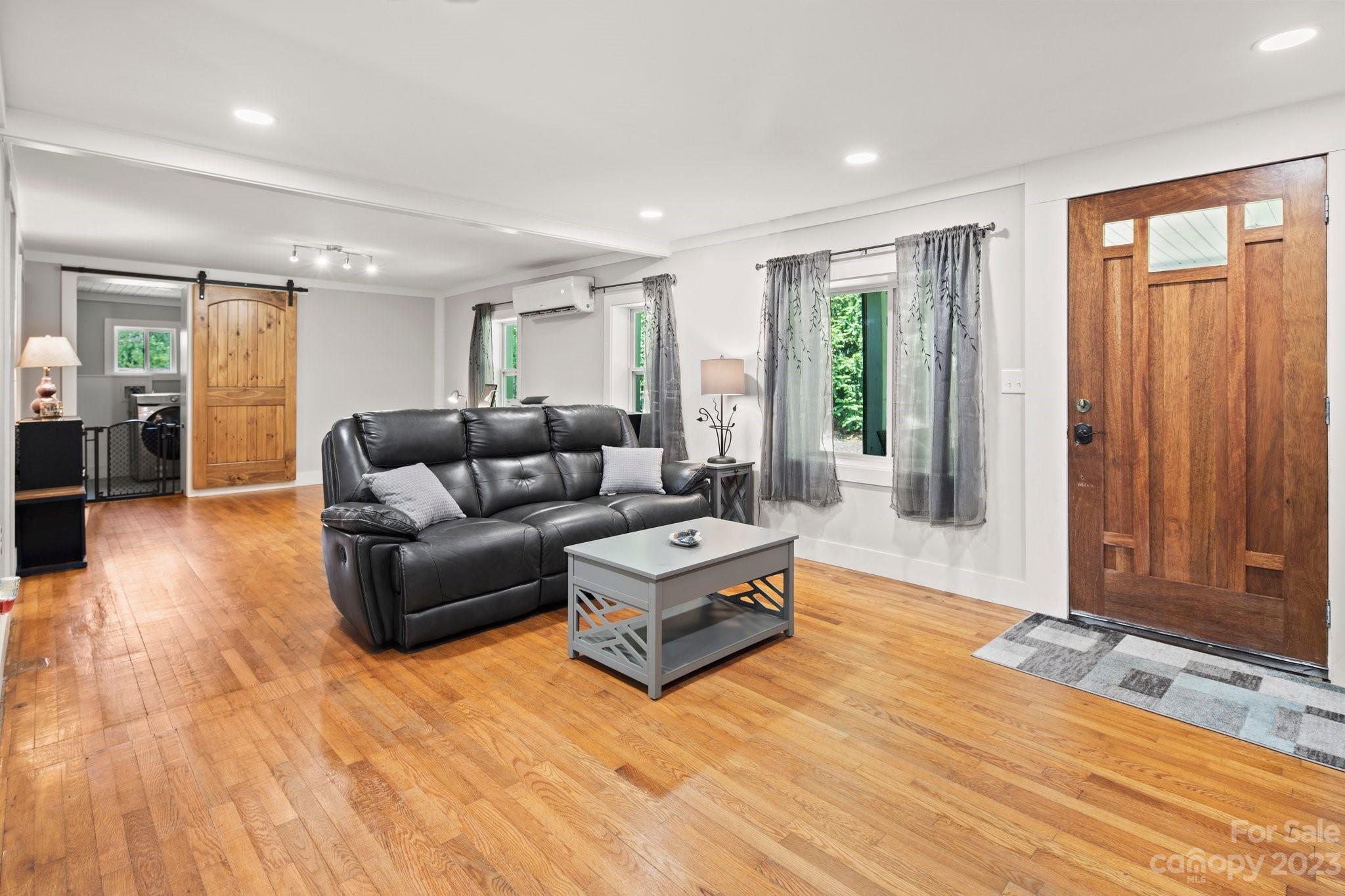 115 James E Davis Drive Mills River, NC 28759 - Photo 5 of 27 a living room with furniture and a window