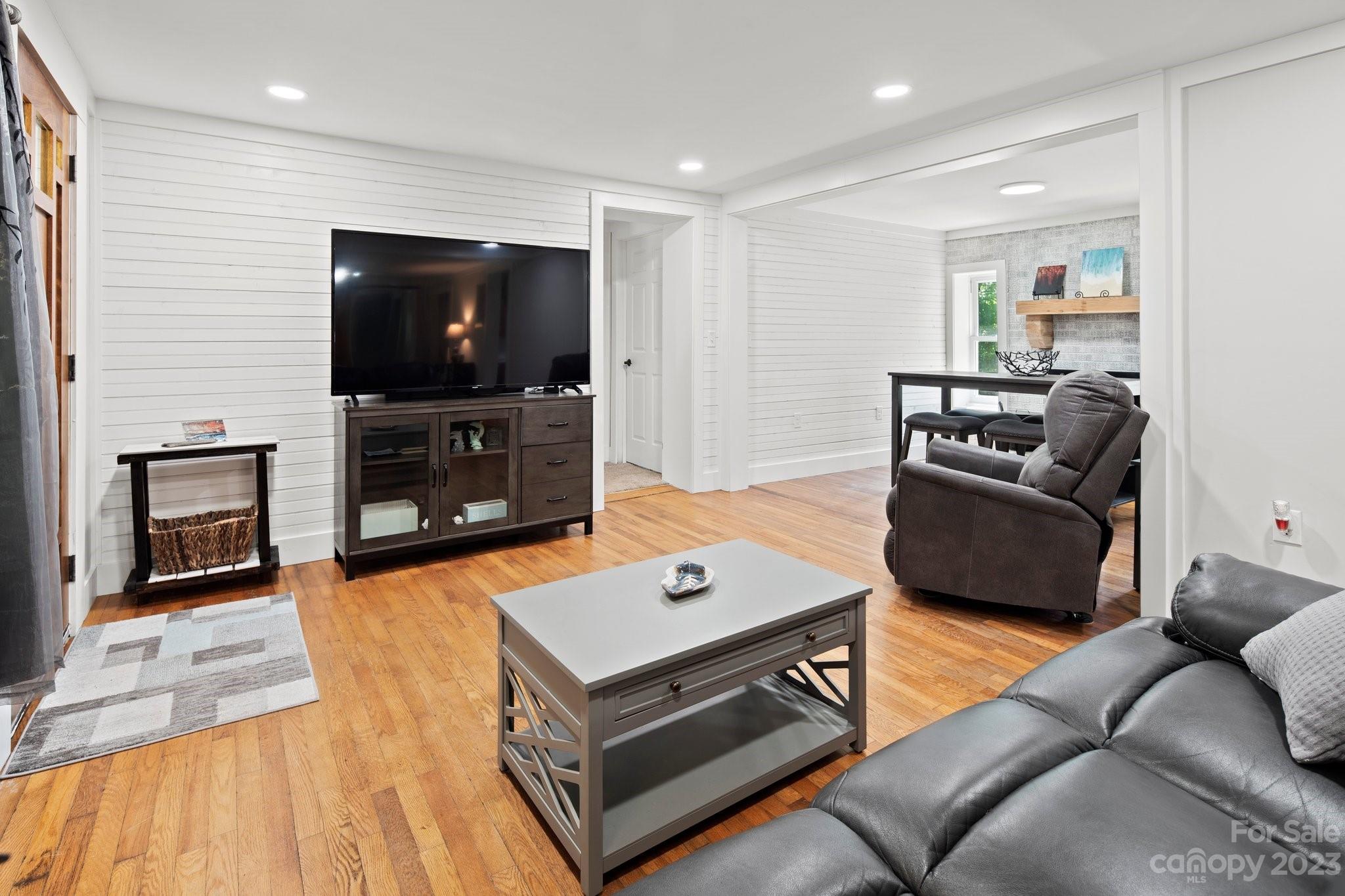 115 James E Davis Drive Mills River, NC 28759 - Photo 6 of 27 a living room with furniture and a flat screen tv