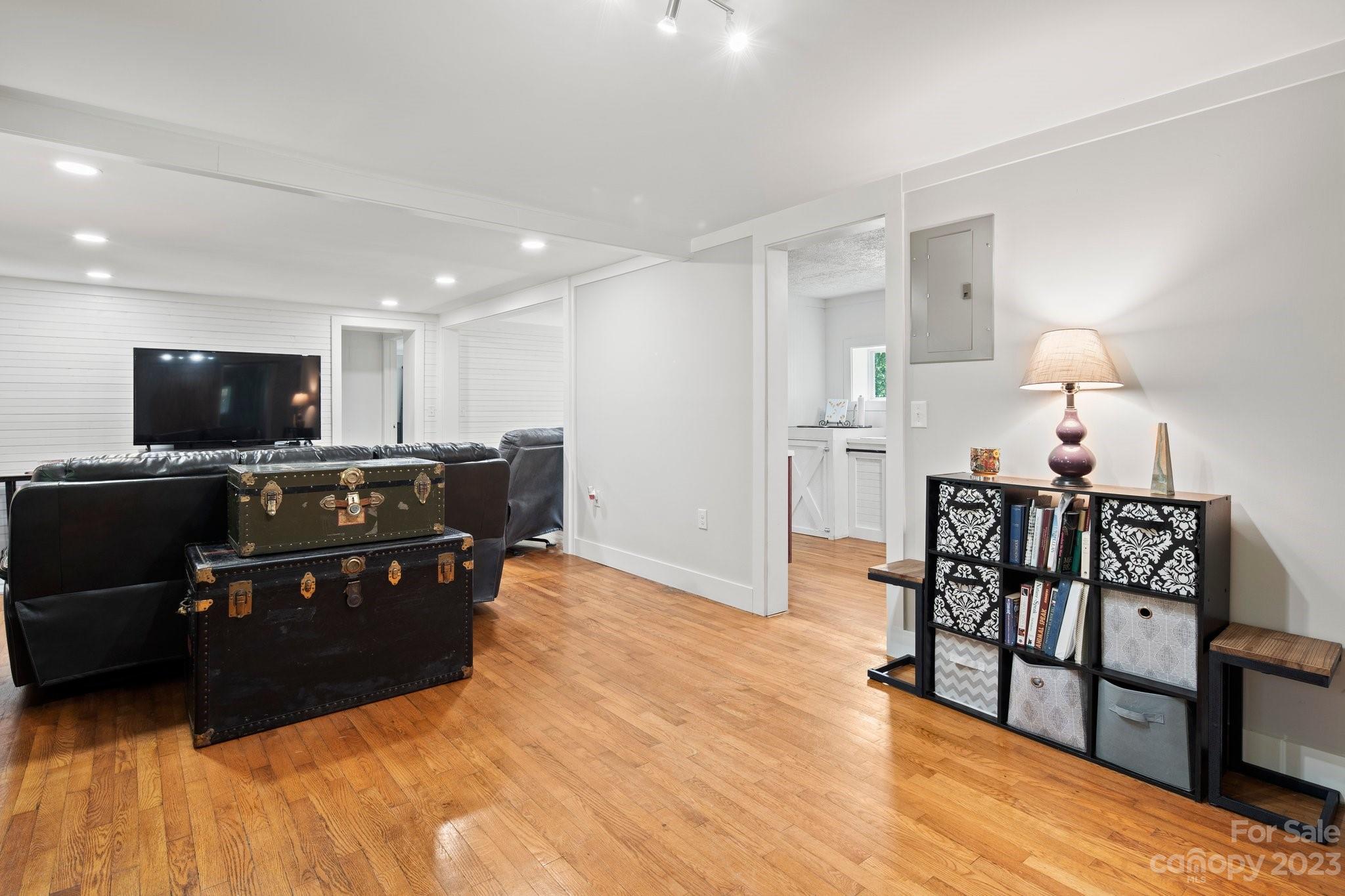 115 James E Davis Drive Mills River, NC 28759 - Photo 7 of 27 a living room with furniture and a flat screen tv