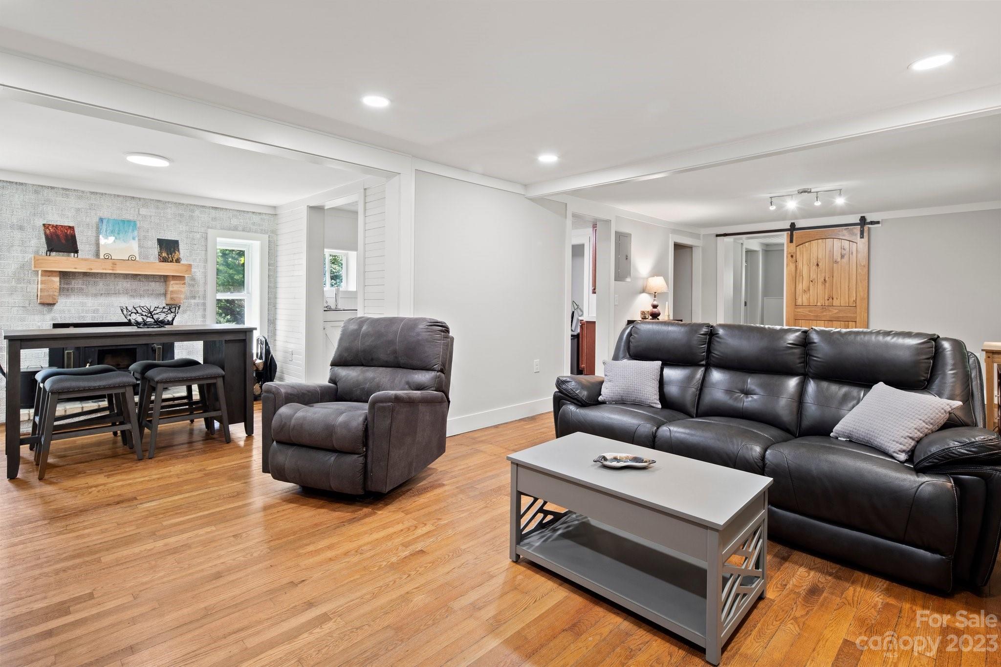 115 James E Davis Drive Mills River, NC 28759 - Photo 8 of 27 a living room with furniture and wooden floor