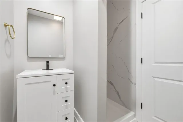 a bathroom with a sink and a mirror