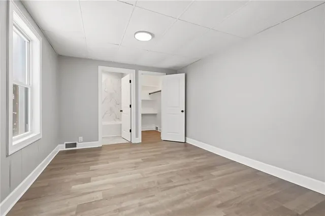 a view of an empty room with a window