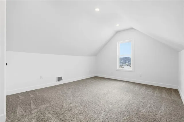 an empty room with a empty space and window