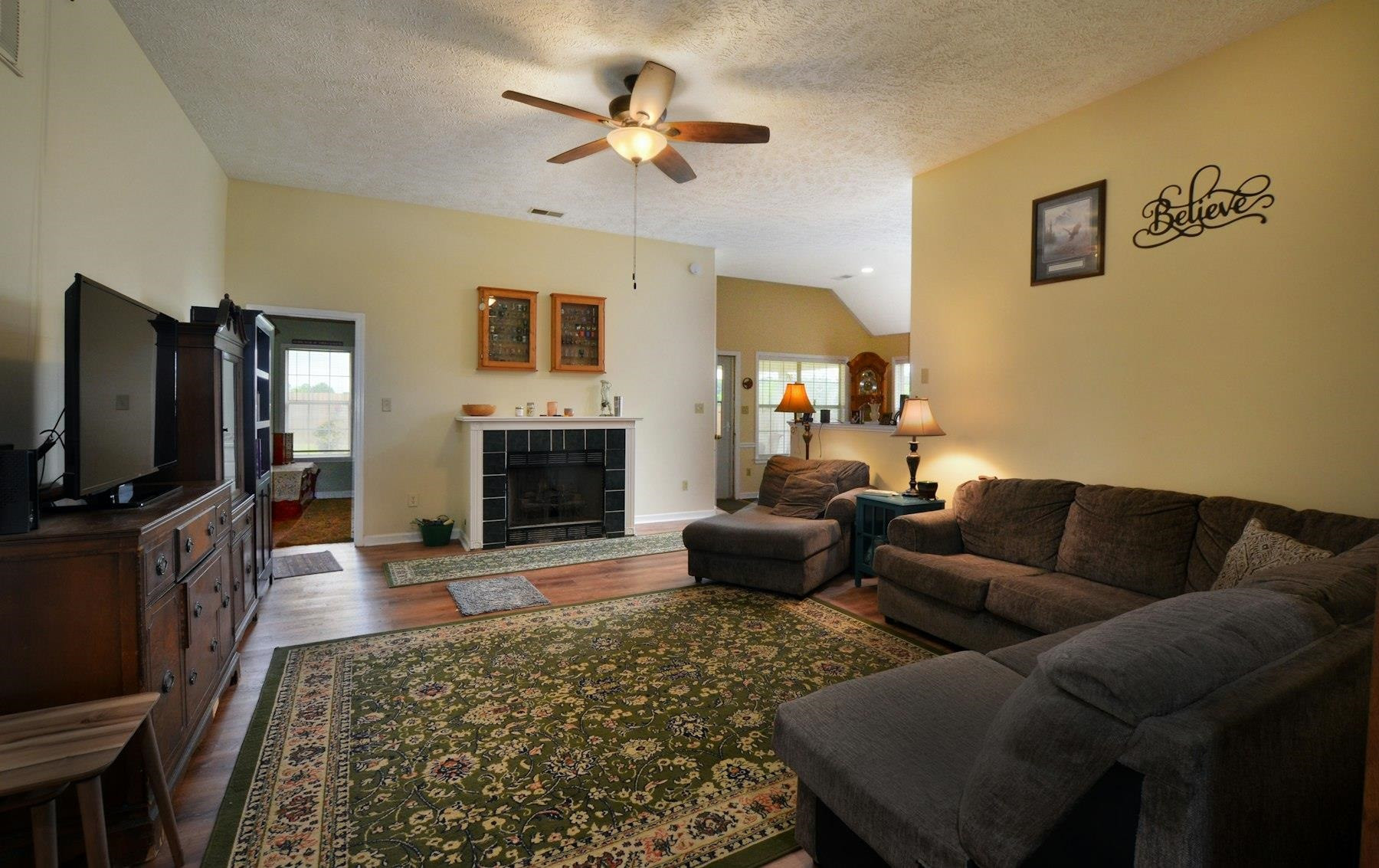 611 Gettysburg Drive Jackson, TN 38305 - Photo 7 of 19 a living room with furniture flat screen tv and a fireplace