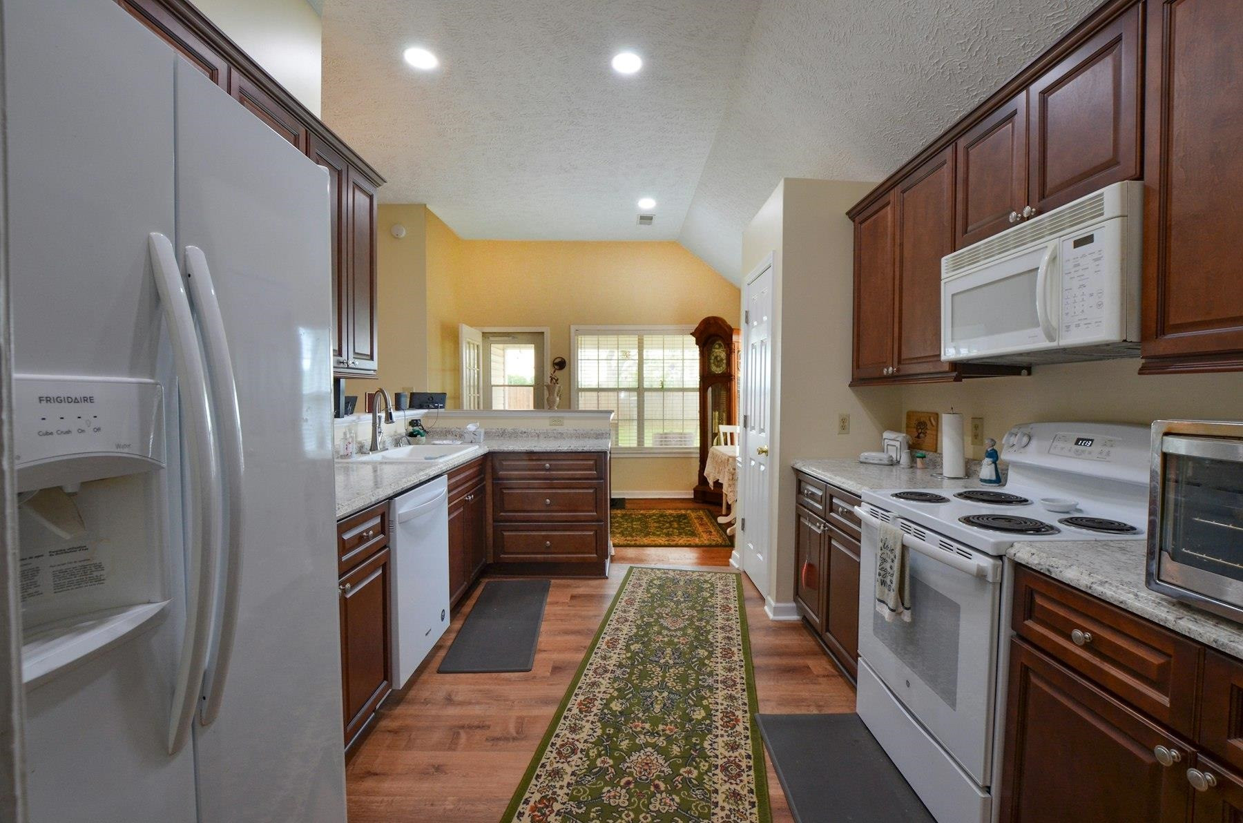 611 Gettysburg Drive Jackson, TN 38305 - Photo 10 of 19 a large kitchen with stainless steel appliances granite countertop a stove a sink dishwasher and a refrigerator