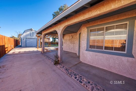 336 North Kern Street Ridgecrest, CA 93555 - Photo 24 of 35 a front view of a house with a yard