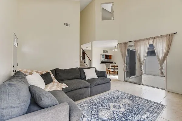 a living room with furniture and a rug