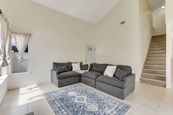 a living room with furniture and a couch