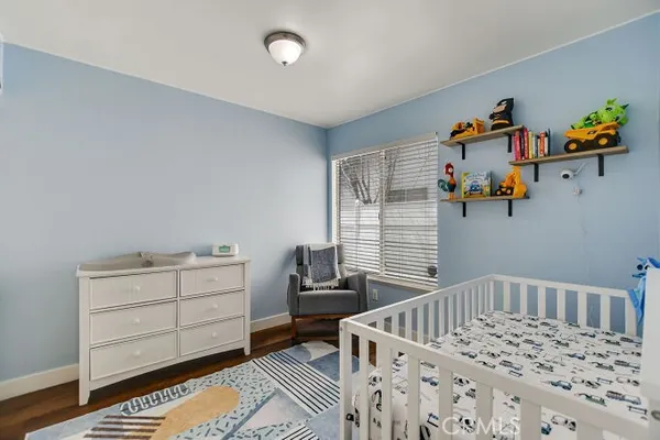 a bedroom with furniture and a window