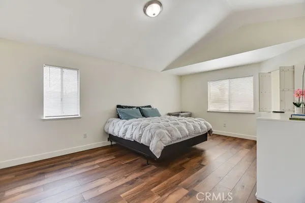 a bedroom with a bed and window