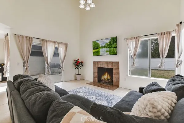 a living room with furniture and a fireplace