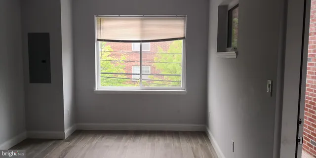 a view of a backyard with a wooden fence