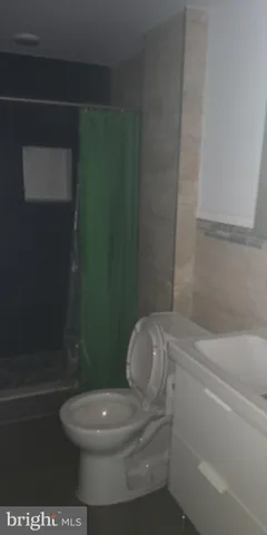 a bathroom with a bathtub and a toilet