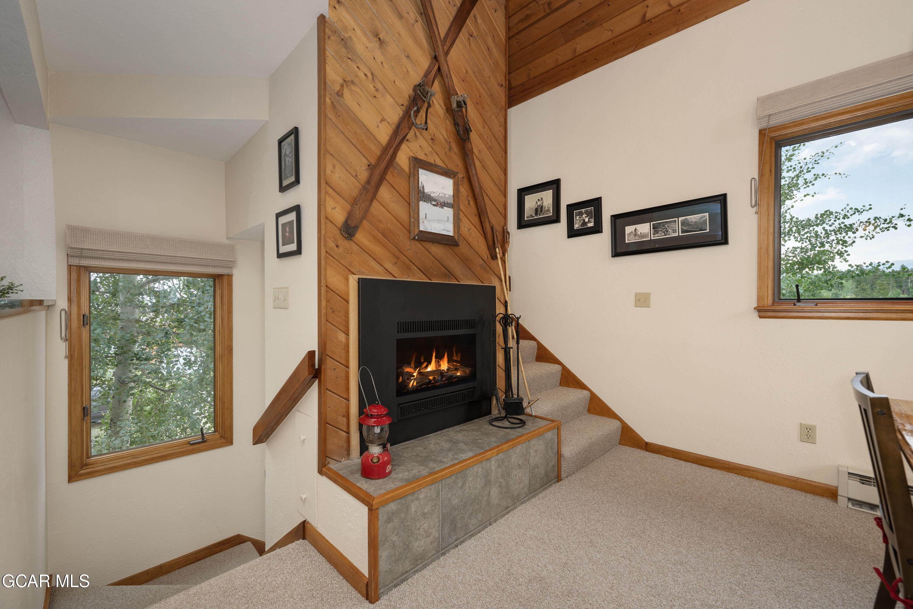820 Wolverine Lane, Unit 3 Fraser, CO 80442 - Photo 7 of 43 a living room with furniture and a fireplace