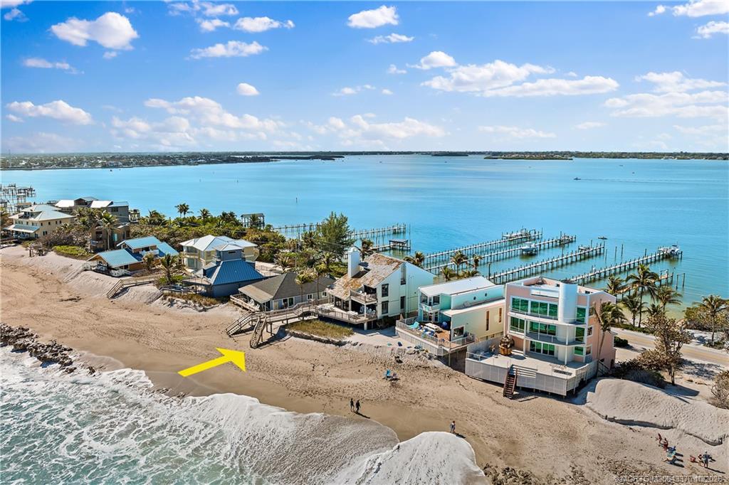 777 Southeast MacArthur Boulevard Stuart, FL 34996 - Photo 1 of 46 a view of a lake in front of house
