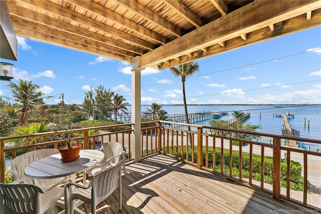 777 Southeast MacArthur Boulevard Stuart, FL 34996 - Photo 16 of 46 a view of balcony with furniture and wooden deck