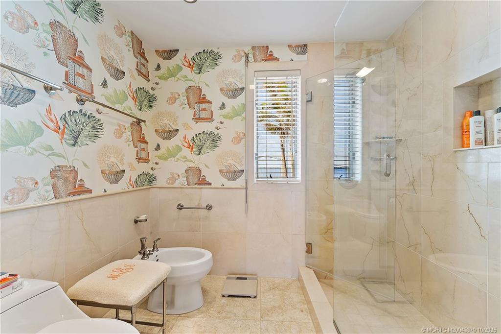 777 Southeast MacArthur Boulevard Stuart, FL 34996 - Photo 26 of 46 a bathroom with a toilet sink and shower