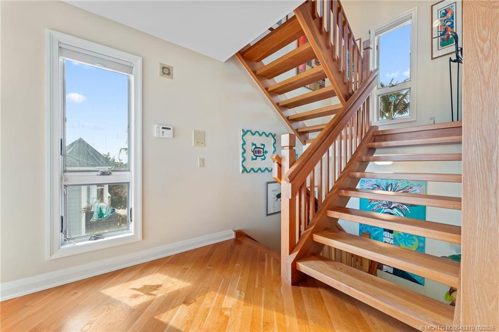 777 Southeast MacArthur Boulevard Stuart, FL 34996 - Photo 27 of 46 a view of entryway with wooden floor and stairs